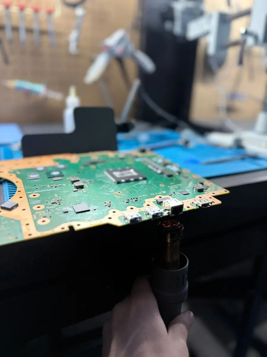 PS5 motherboard board-level repair at OneClick Phone Repairs in Fullerton, CA